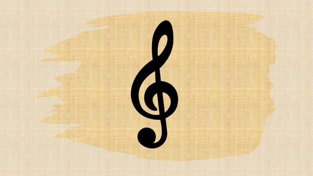 A treble clef symbol with a wooden background